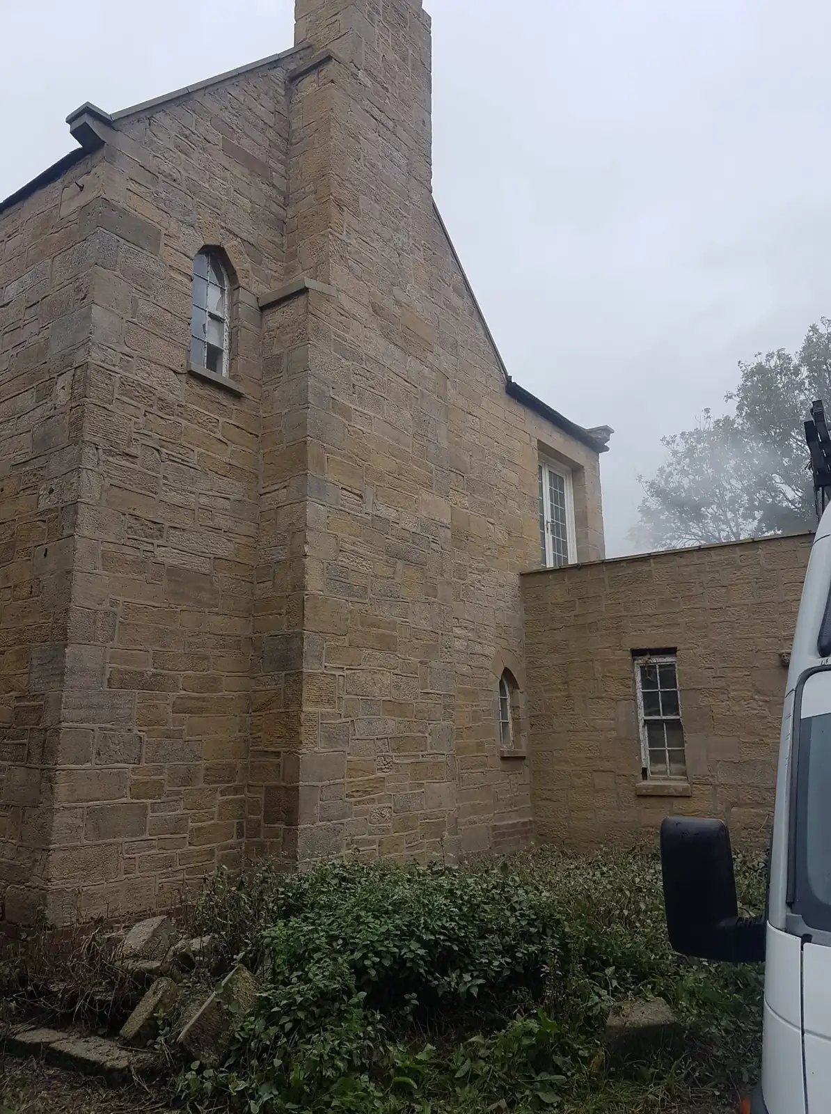 Stone house side elevation after cleaning