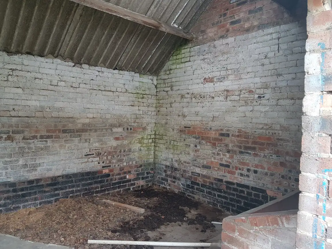 Painted brick wall before shot blasting in Chester-le-Street