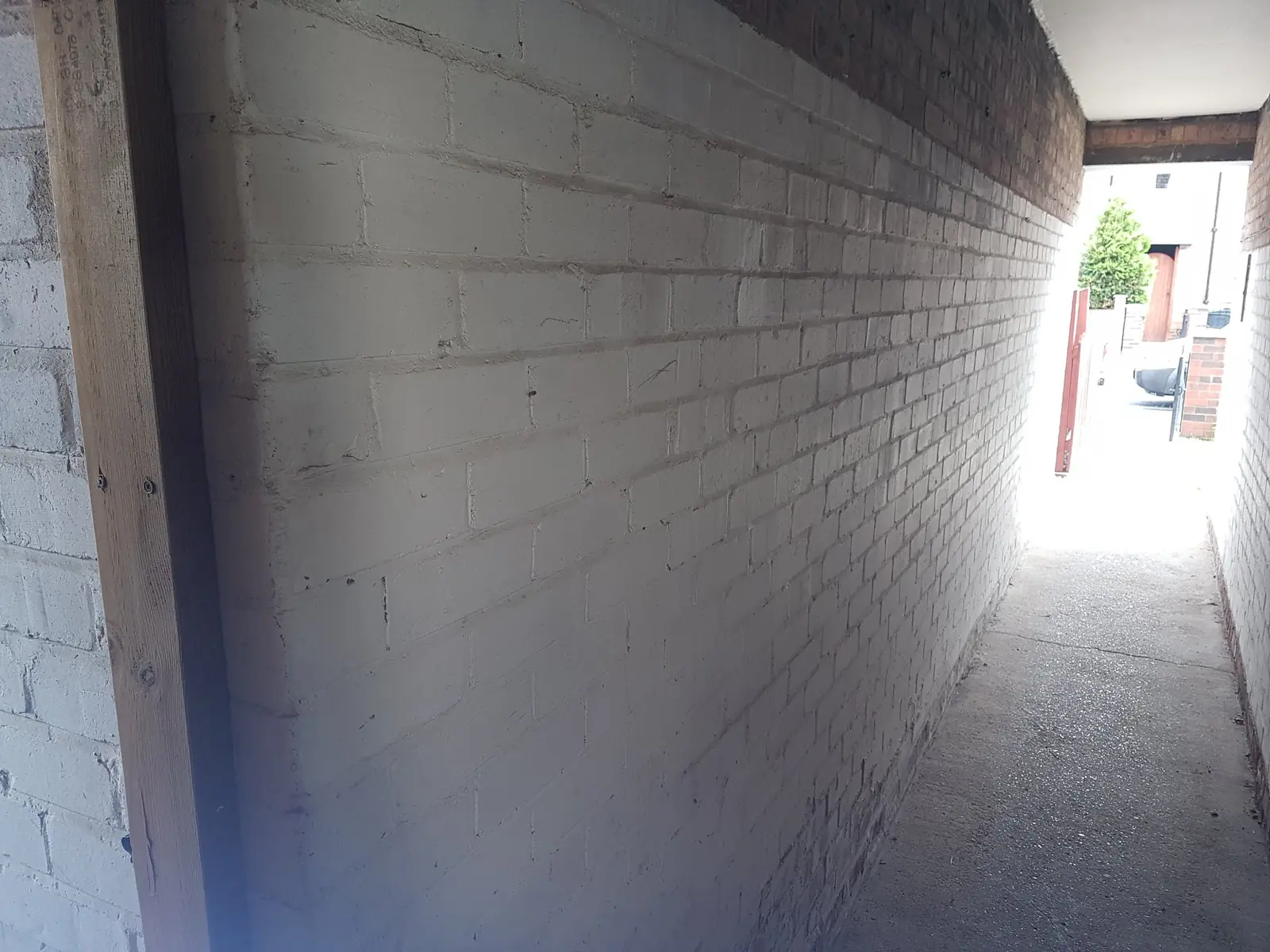 Painted brick alley wall before sand blasting in Newcastle