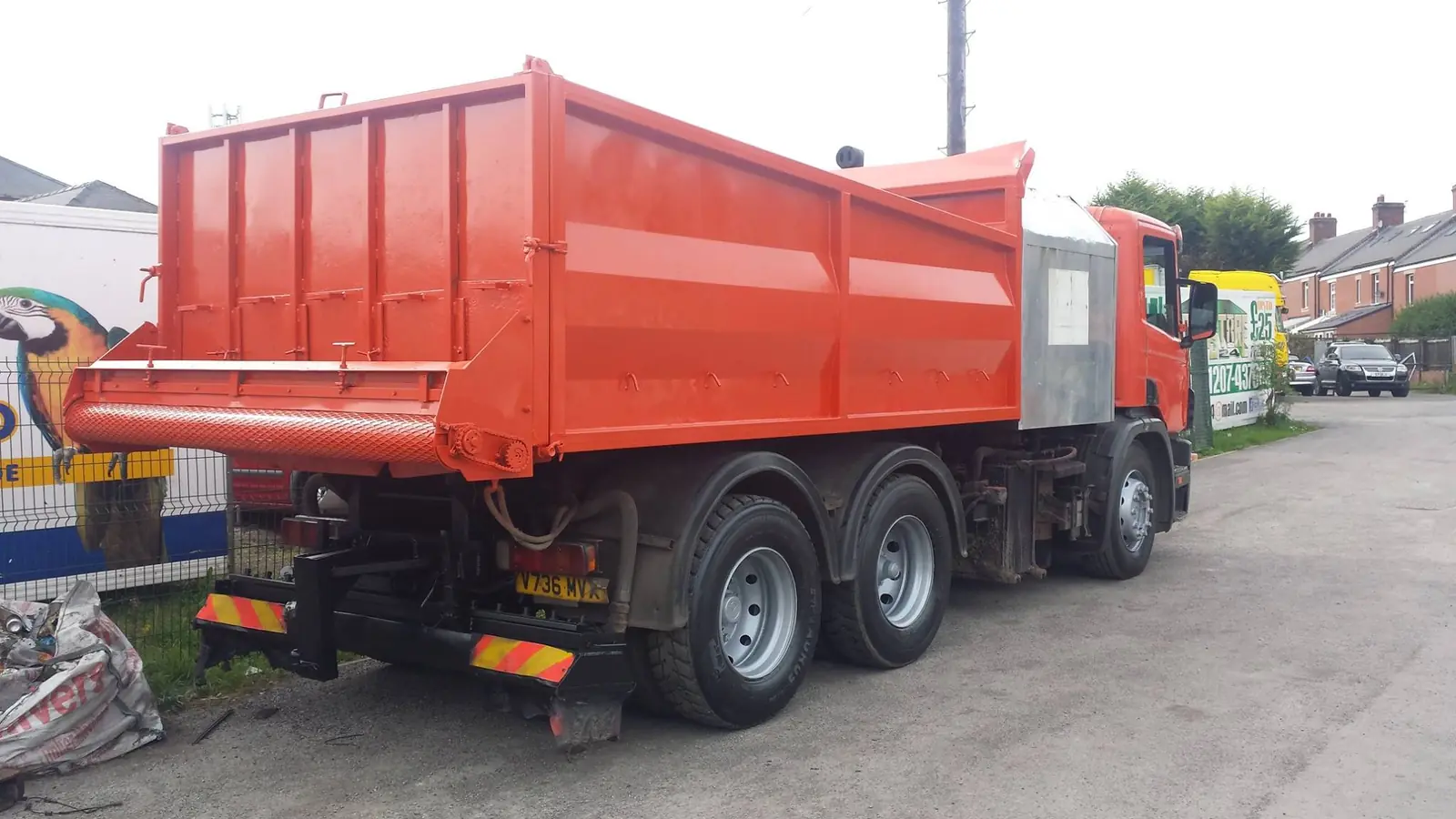 Tipper lorry body painted orange after blasting