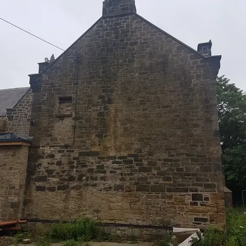 Sandstone gable end before cleaning