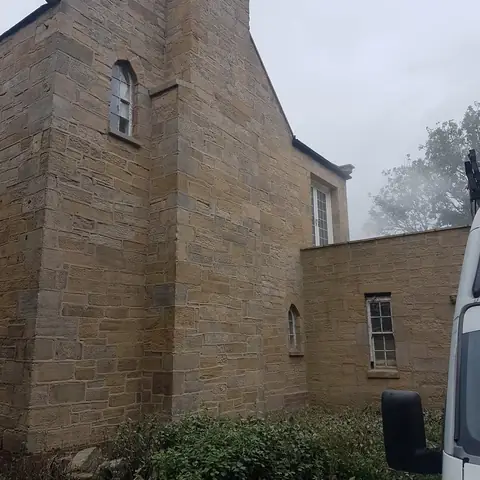 Stone house side elevation after cleaning