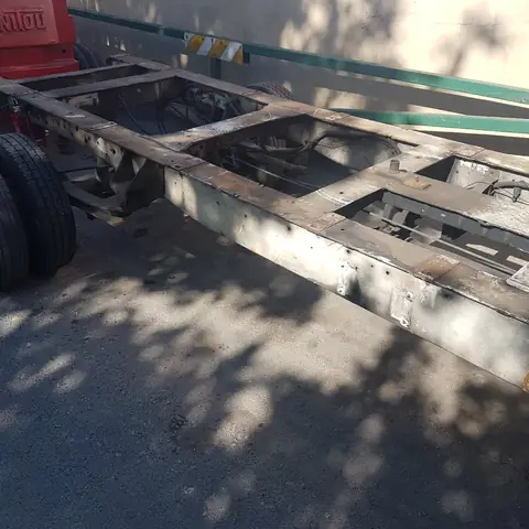 Rusted lorry chassis before shot blasting