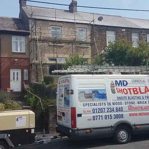 Mobile blasting van on terraced street