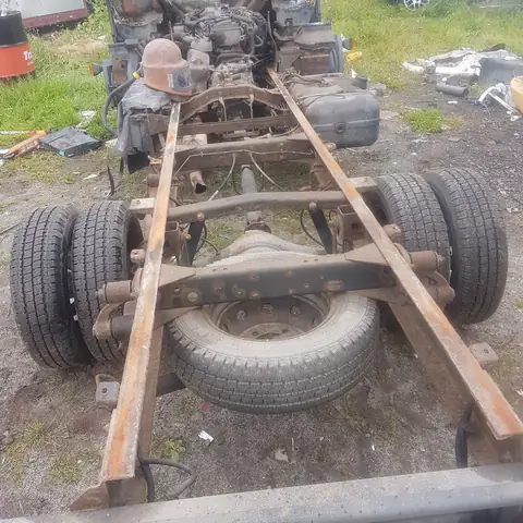 Rusted lorry chassis before restoration