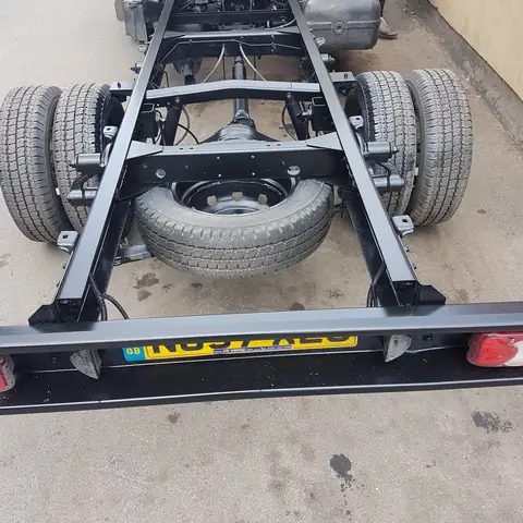 Lorry chassis painted black rear view