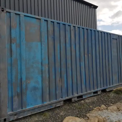 Rusted shipping container before blasting