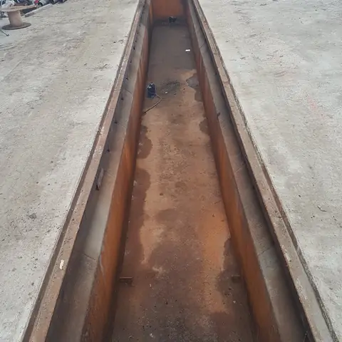 Rusted steel channel before blasting