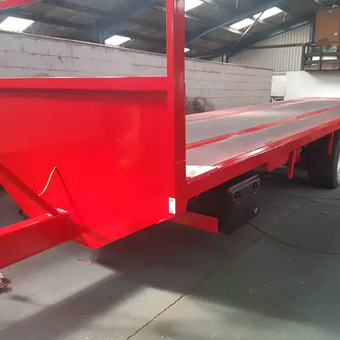 Flatbed trailer painted red