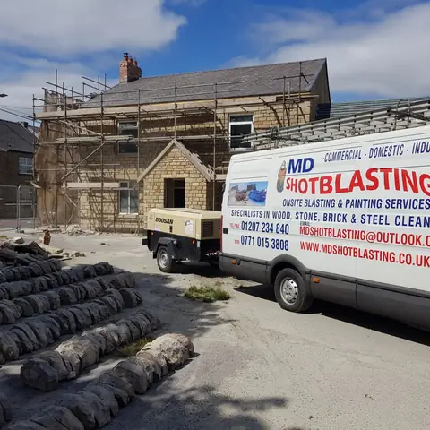 Blasting van and compressor at stone renovation