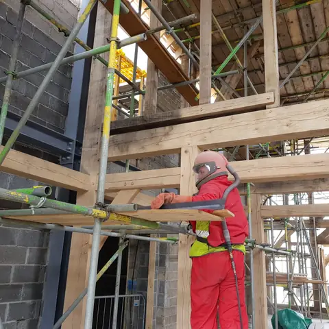 Operative blast cleaning oak frame
