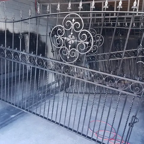 Ornate iron gates after blasting