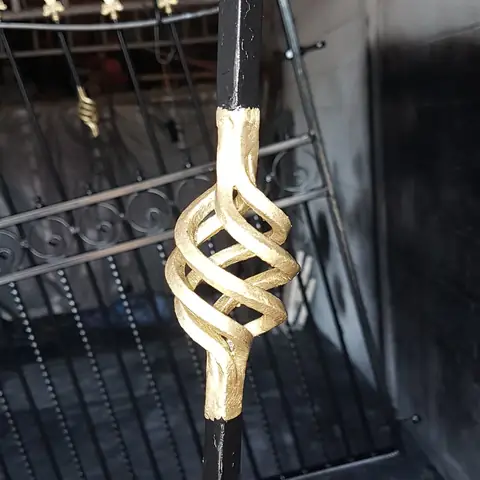 Gold twist detail on black railings