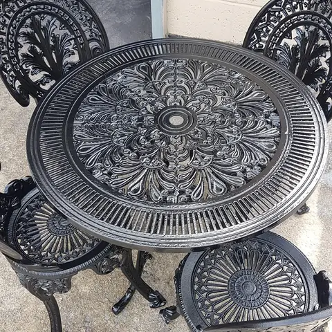 Cast iron garden table painted black
