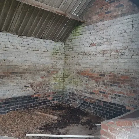 Painted brick wall before cleaning