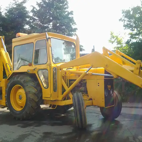 Restored yellow backhoe loader