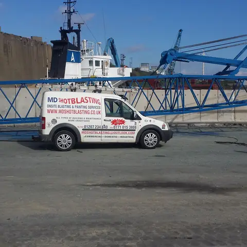 Mobile blasting van at dockside