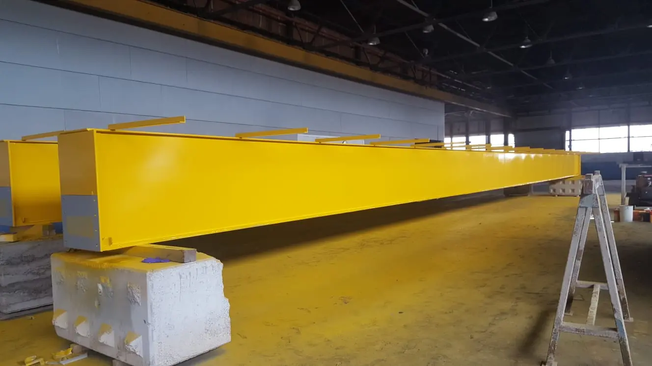 Steel beam primed and painted yellow after blasting and painting in County Durham