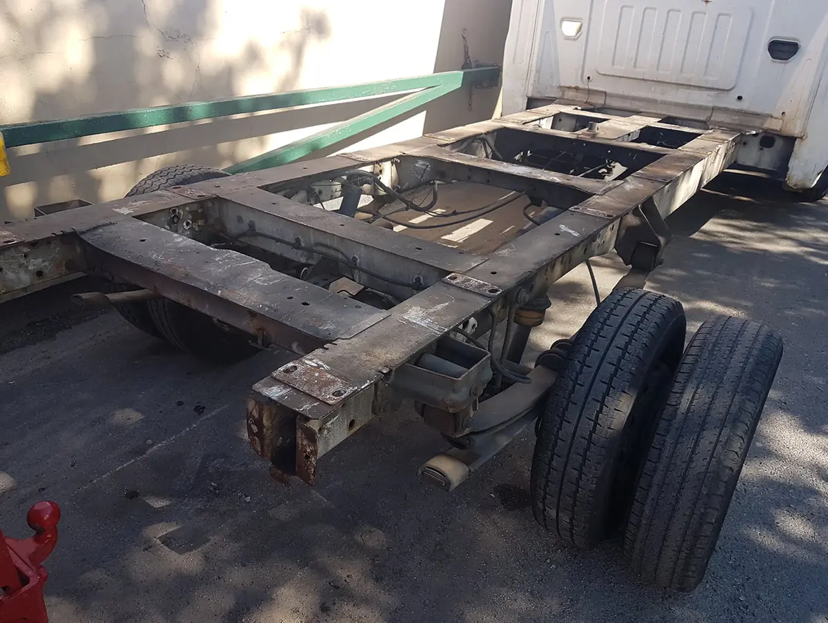 Rusted lorry chassis before shot blasting