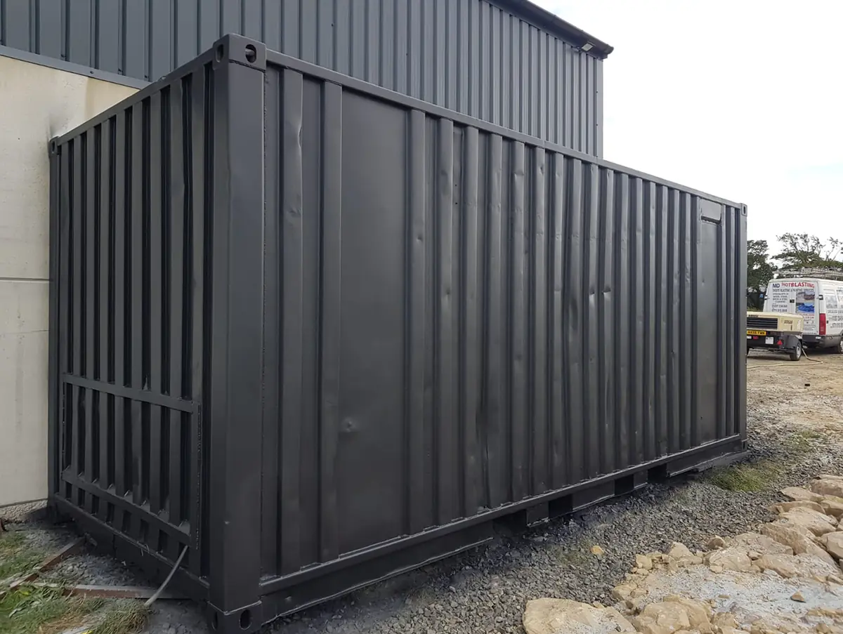 Shipping container after blasting and painting black